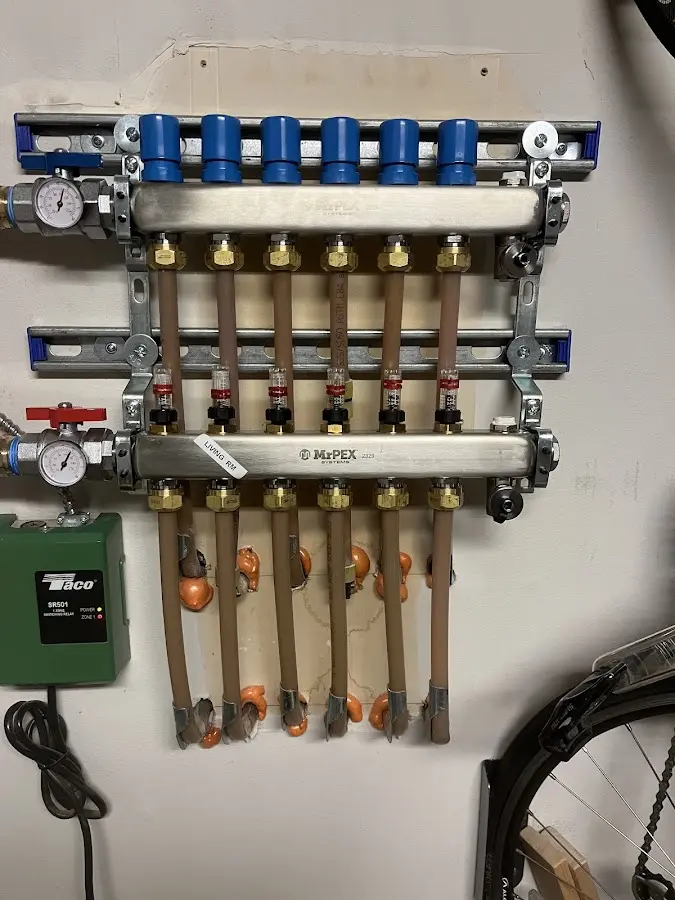 Plumber performing Water Heater Repair at a residential property in Eastman