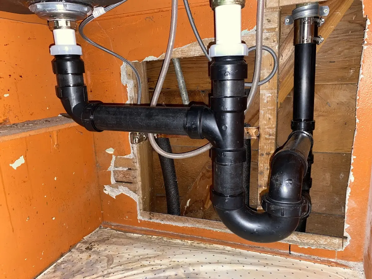 Professional Garbage Disposal Repair equipment and tools on the job in Eastman
